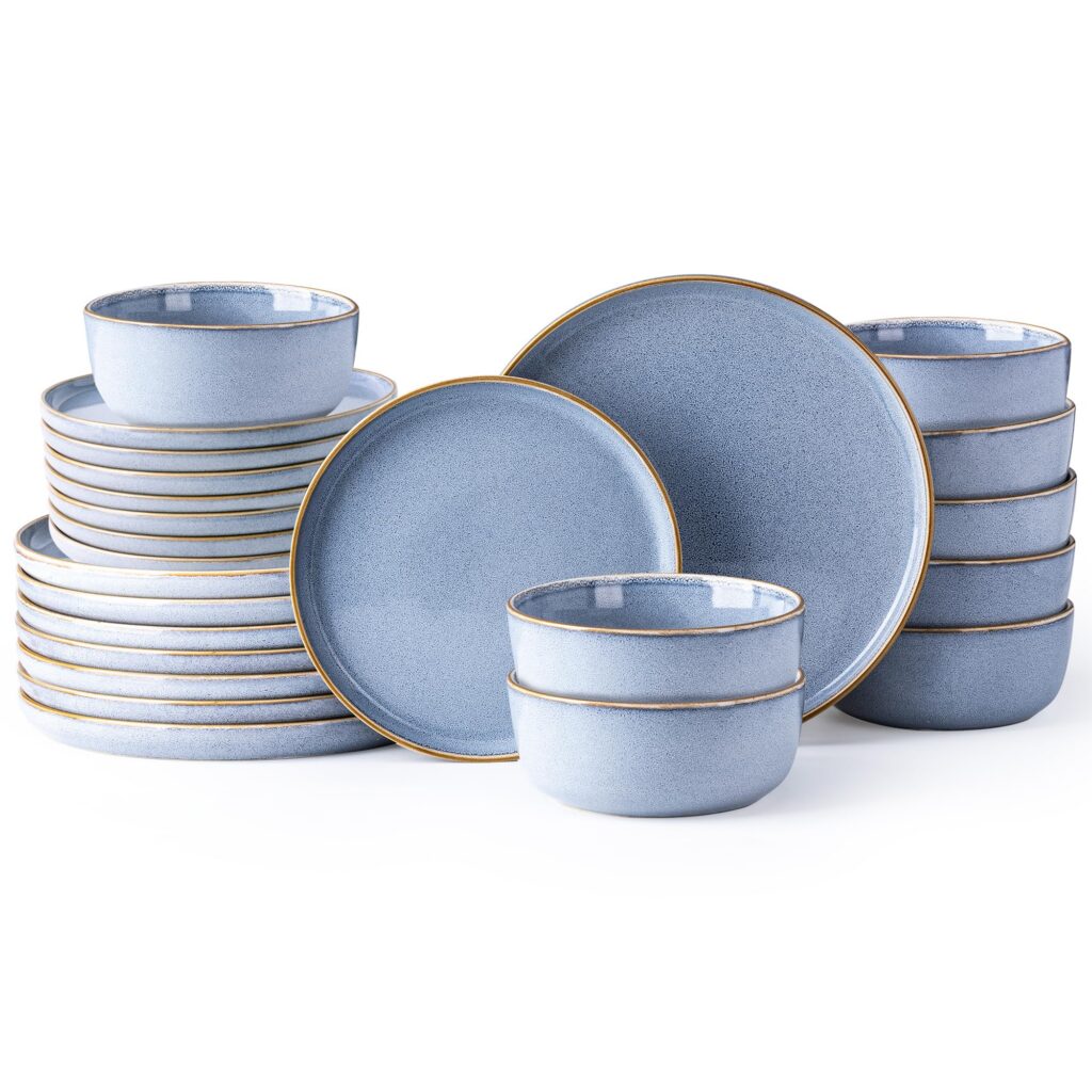 Blue ceramic dinnerware set with bowls and plates.