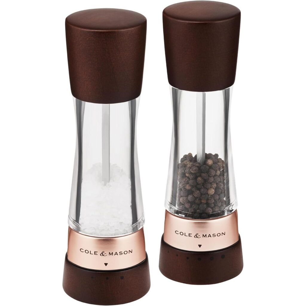 Salt and pepper grinders with copper accents.