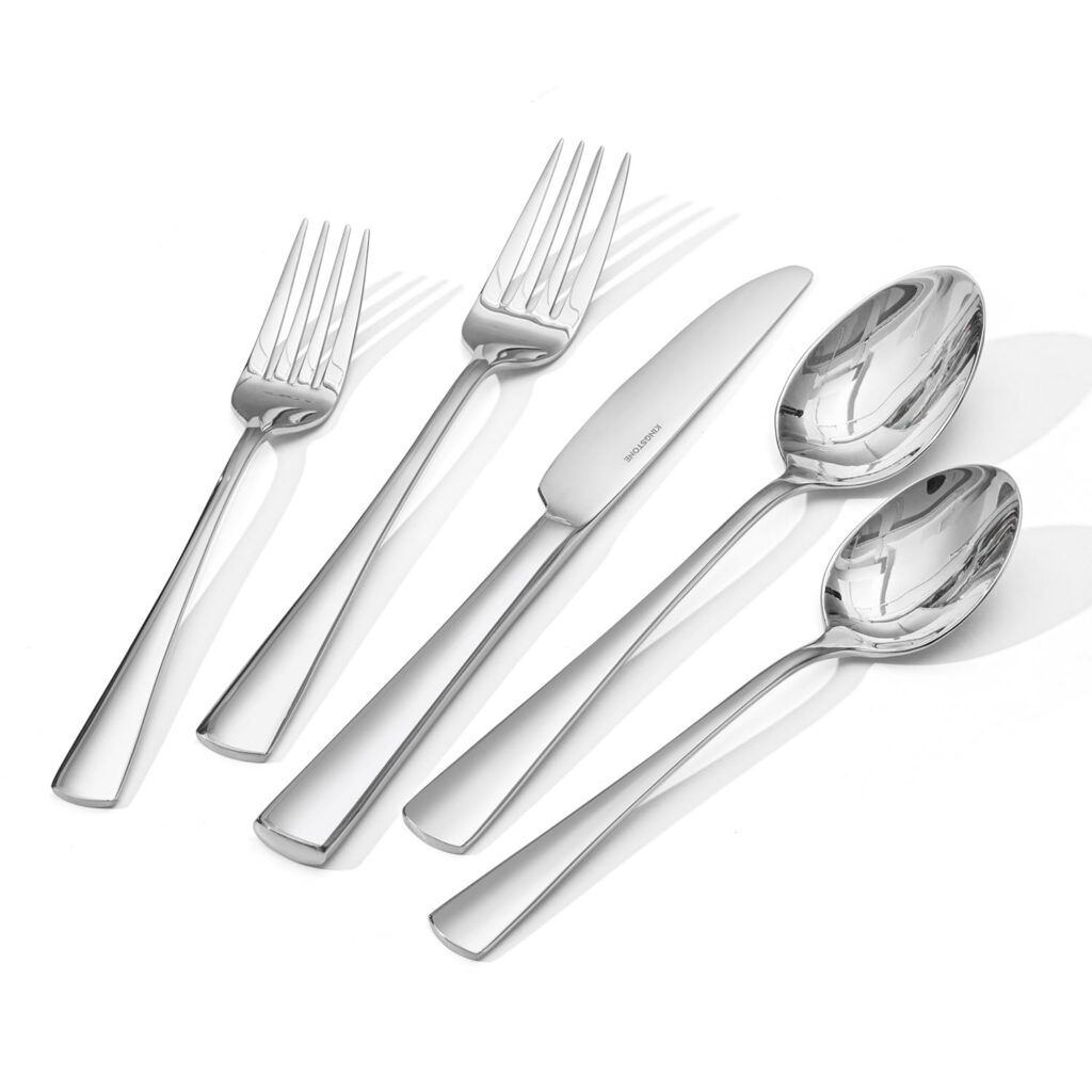 Silver cutlery set with forks, knife, spoons.